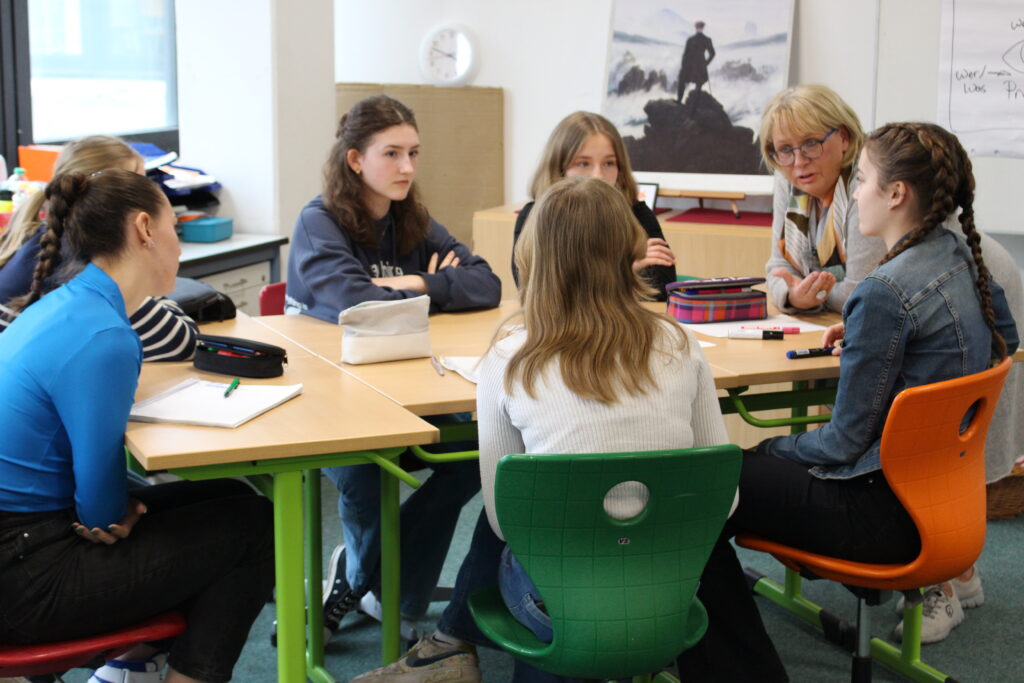 A group of students discussing on a table